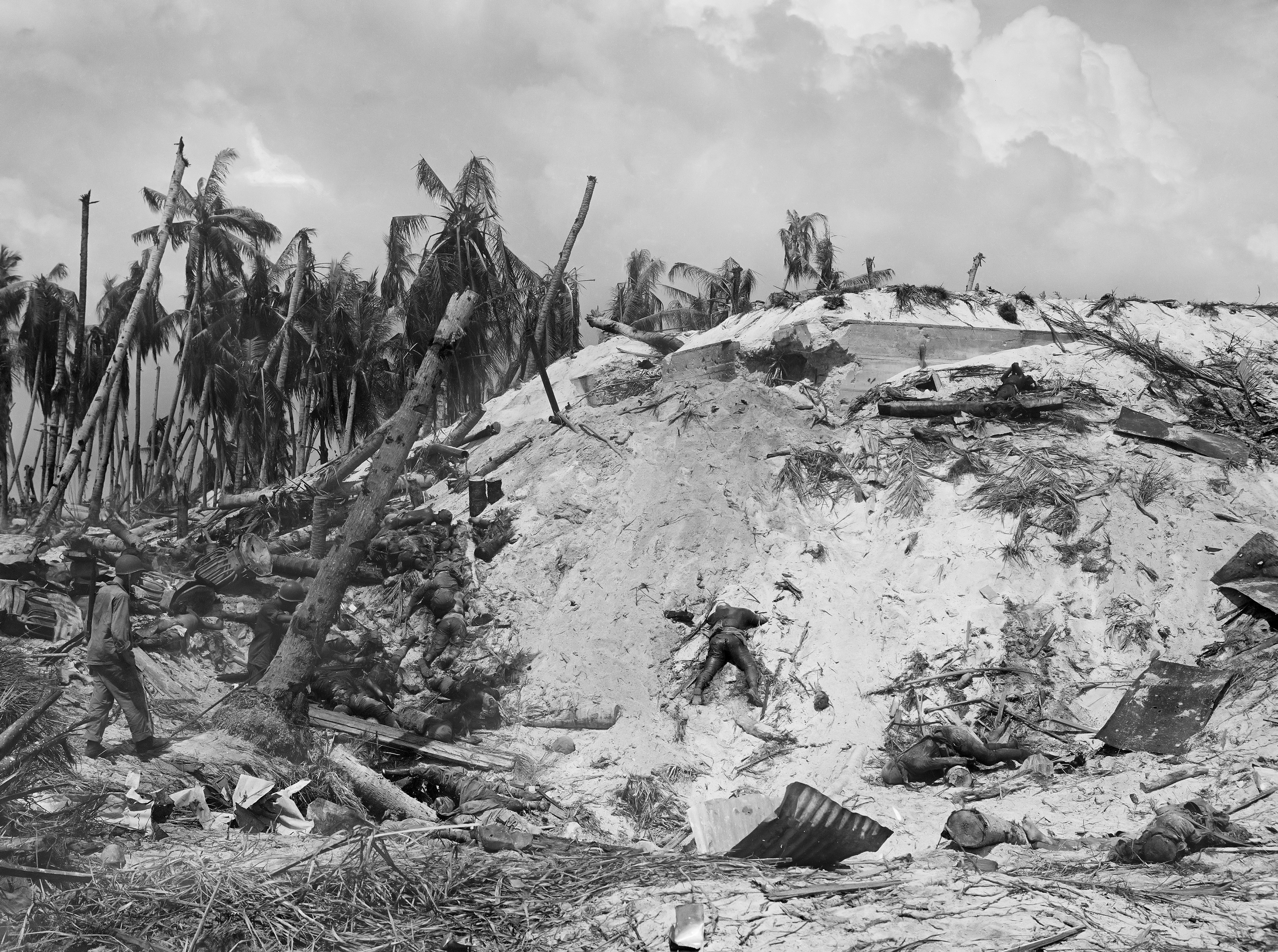 Dead Japanese soldiers lay scattered around a blasted Japanese pillbox on Tarawa Atoll in the Gilbert Islands of the South Pacific on Nov. 11, 1943 during World War II. (AP Photo/Frank Filan)
