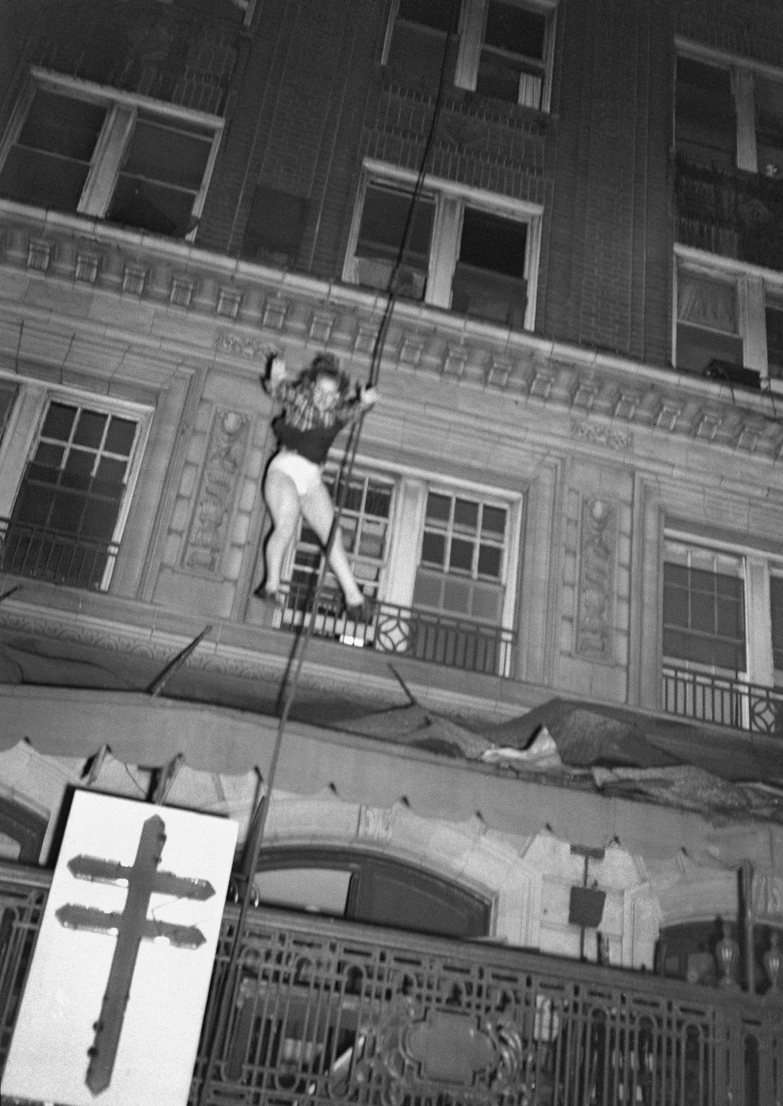 A woman plunges from the upper floors of Atlanta’s Winecoff Hotel as a fire traps many occupants, Dec. 7, 1946. The woman was reported to have survived after her fall was broken by part of the hotel marquee. The fire killed 119 people, including he hotel’s owners. (Arnold Hardy via AP) 