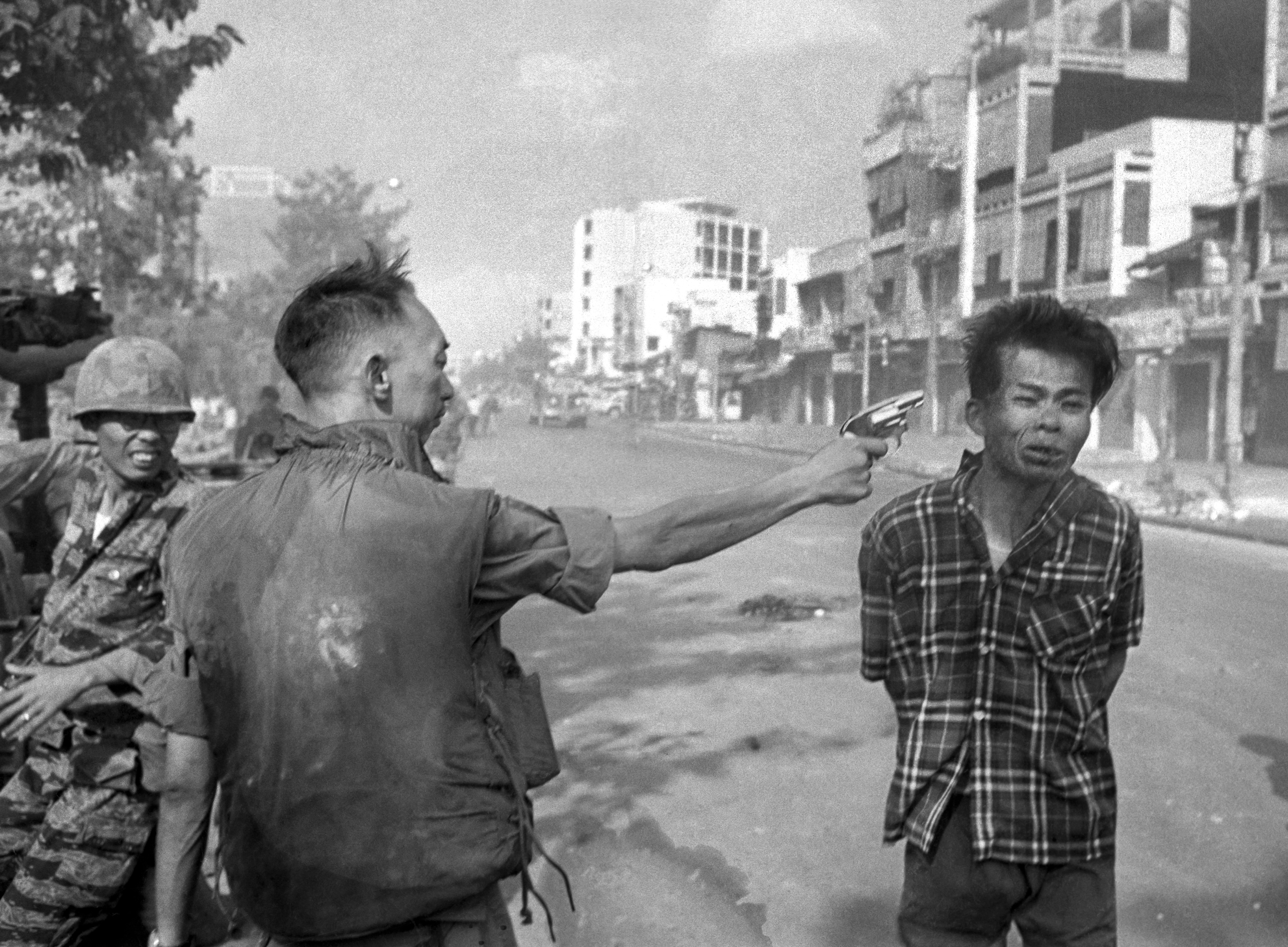 South Vietnamese Gen. Nguyen Ngoc Loan, chief of the national police, fires his pistol into the head of suspected Viet Cong officer Nguyen Van Lem (also known as Bay Lop) on a Saigon street Feb. 1, 1968, early in the Tet Offensive. The general said Nguyen Van Lem was responsible for numerous Vietnamese and American deaths. (AP Photo/Eddie Adams)
