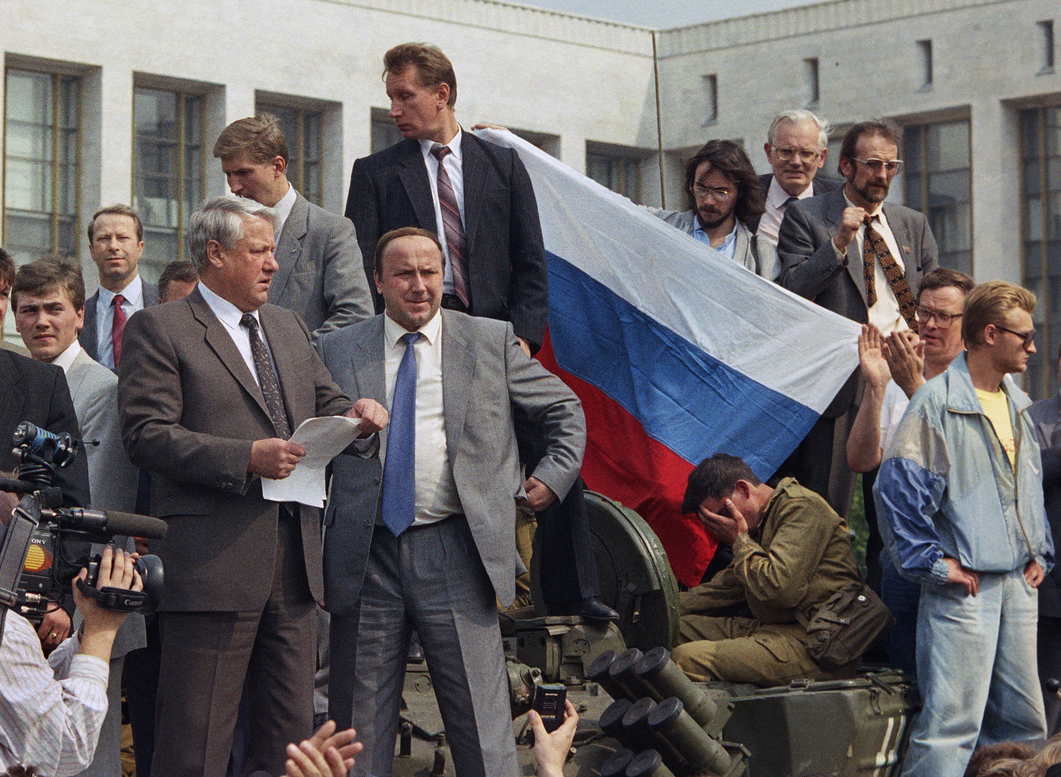 Boris Yeltsin, president of the Russian Federation, makes a speech from atop a tank in front of the Russian parliament building in Moscow, U.S.S.R., Monday, Aug. 19, 1991. Yeltsin called on the Russian people to resist the communist hard liners in the Soviet coup. (AP Photo)