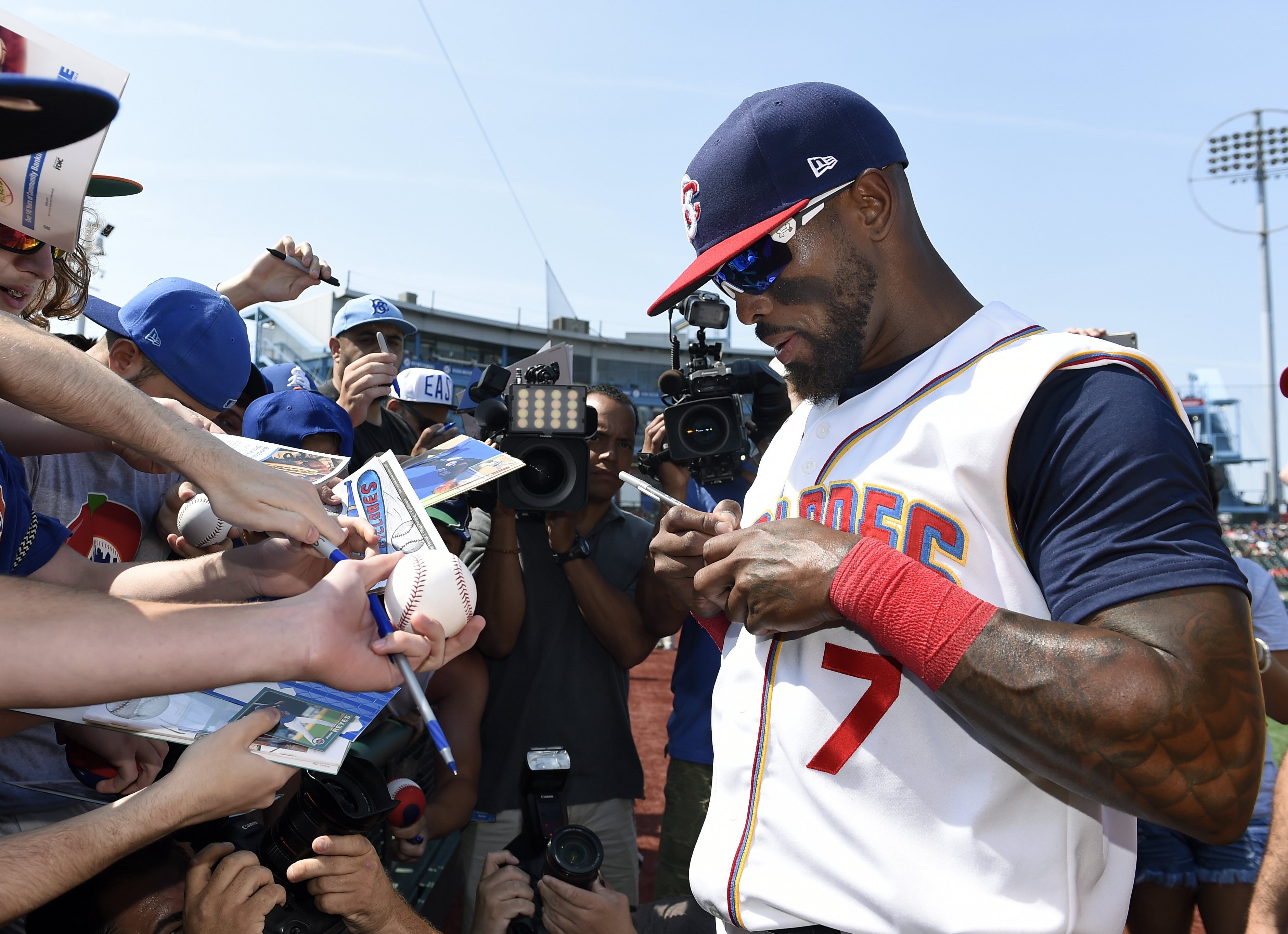 Jose Reyes, who agreed to a Minor League contract with the New York Mets, signs autographs Sunday after joining the team's affiliated Brooklyn Cyclones. The Cyclones' games are being reported by AP in an expansion of Minor League coverage. (AP Photo/Kathy Kmonicek)
