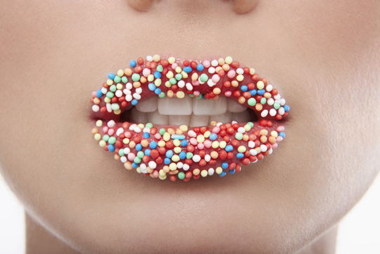 Female lips covered neatly in sprinkles